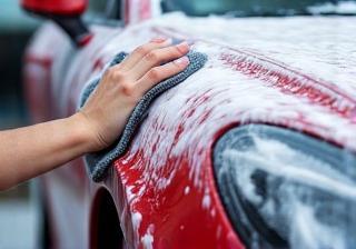 Car being hand washed with foam